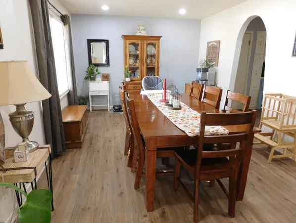 a view of a dining room with furniture and wooden floor