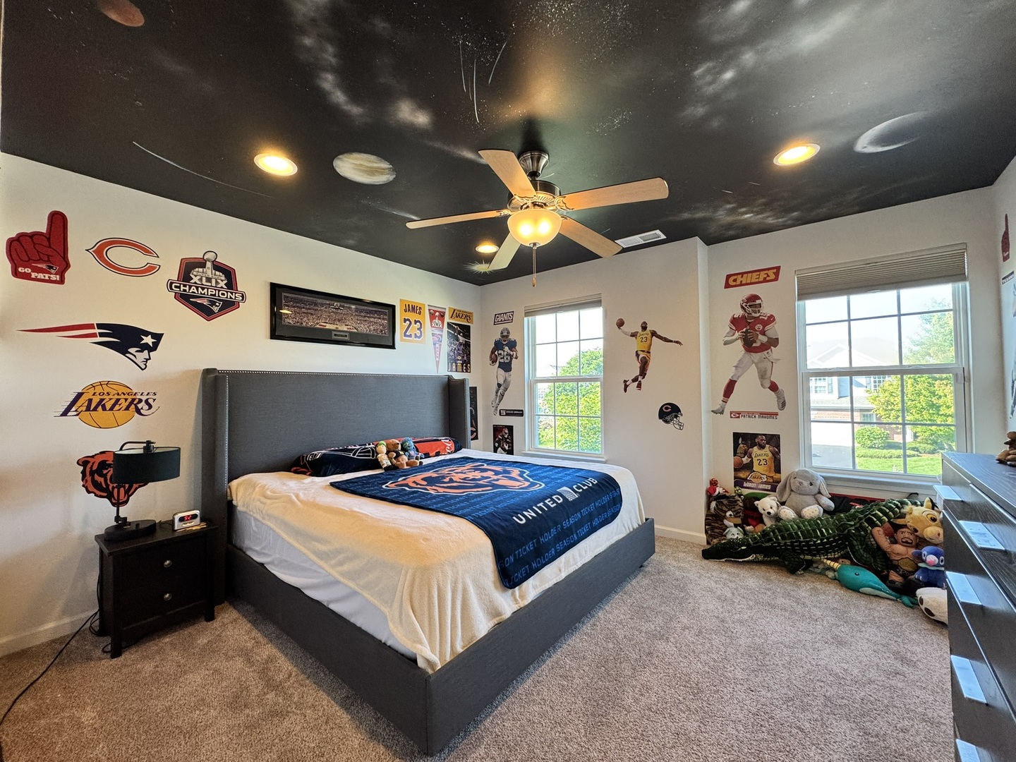 12903 Cypress Lane Plainfield, IL 60585 - Photo 17 of 30 a bedroom with a bed and a large window with the potted plants