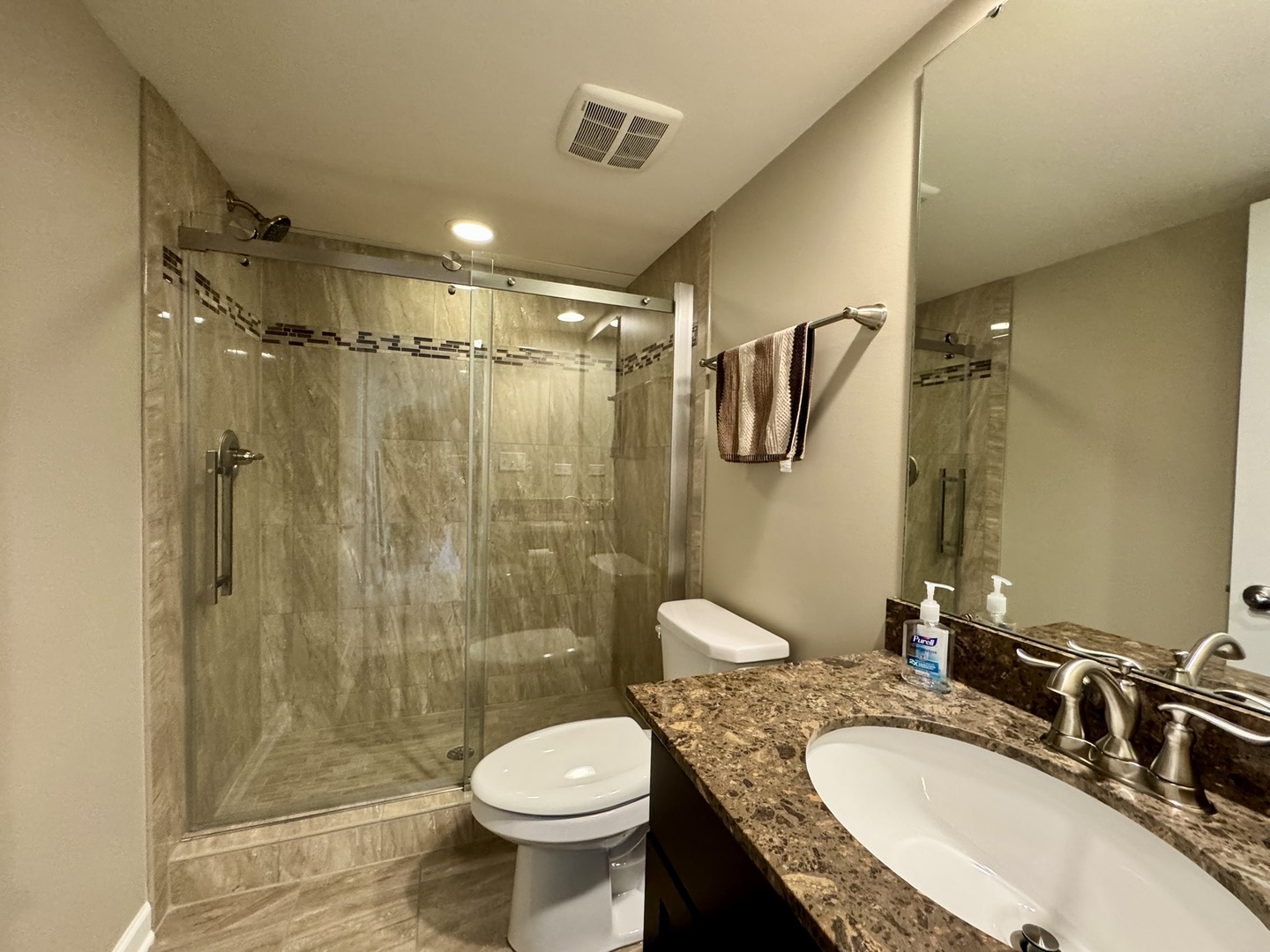 12903 Cypress Lane Plainfield, IL 60585 - Photo 24 of 30 a bathroom with a granite countertop sink toilet a shower and a mirror