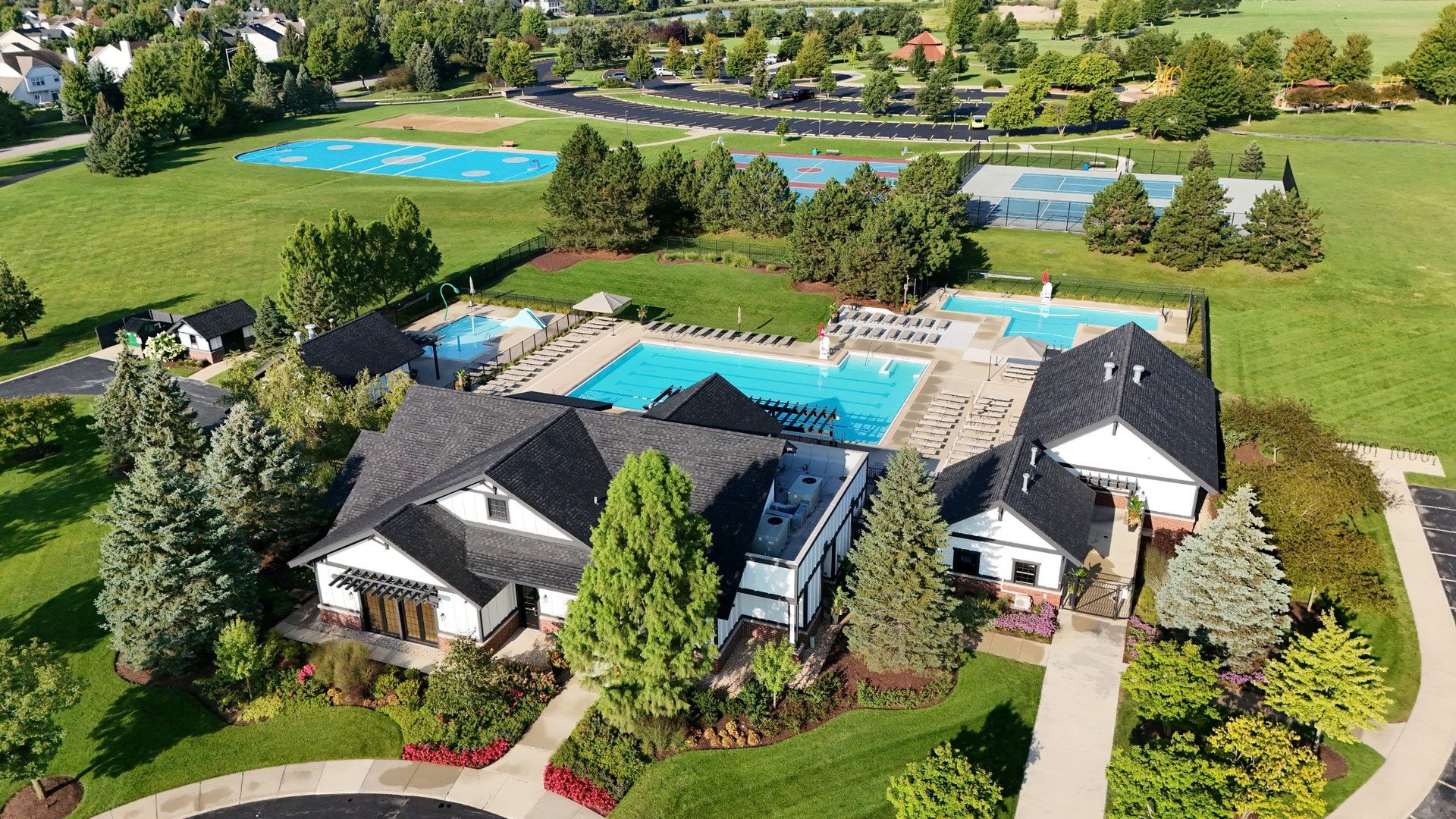 12903 Cypress Lane Plainfield, IL 60585 - Photo 29 of 30 an aerial view of a house with a garden and lake view