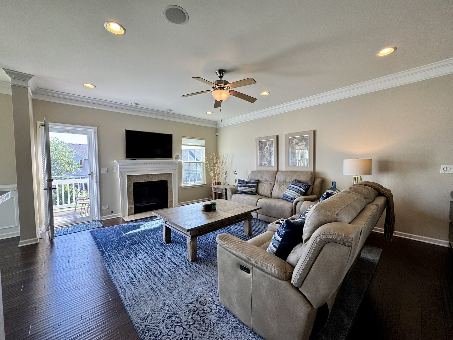12903 Cypress Lane Plainfield, IL 60585 - Photo 4 of 30 a living room with furniture a fireplace and a flat screen tv