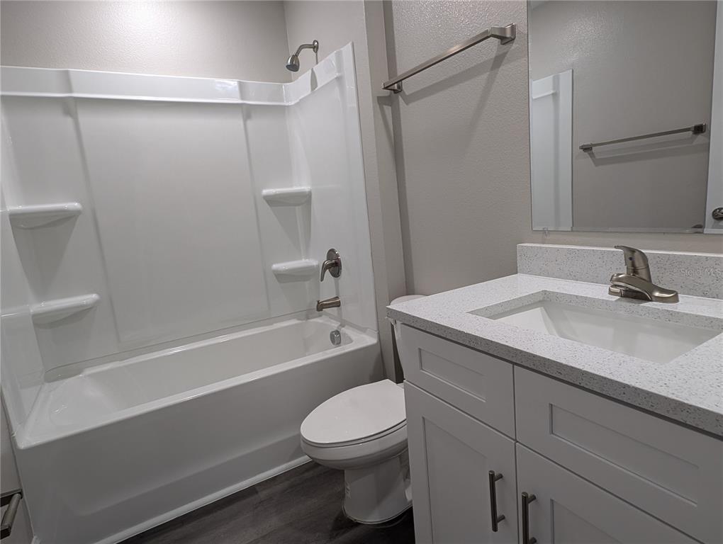 1225 Vanderway Lane Lady Lake, FL 32159 - Photo 13 of 13 a bathroom with a sink a toilet and shower