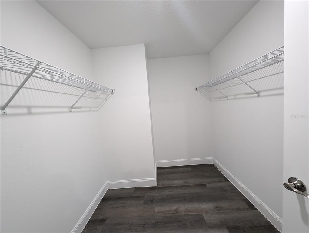 1225 Vanderway Lane Lady Lake, FL 32159 - Photo 10 of 13 a view of a room with empty racks