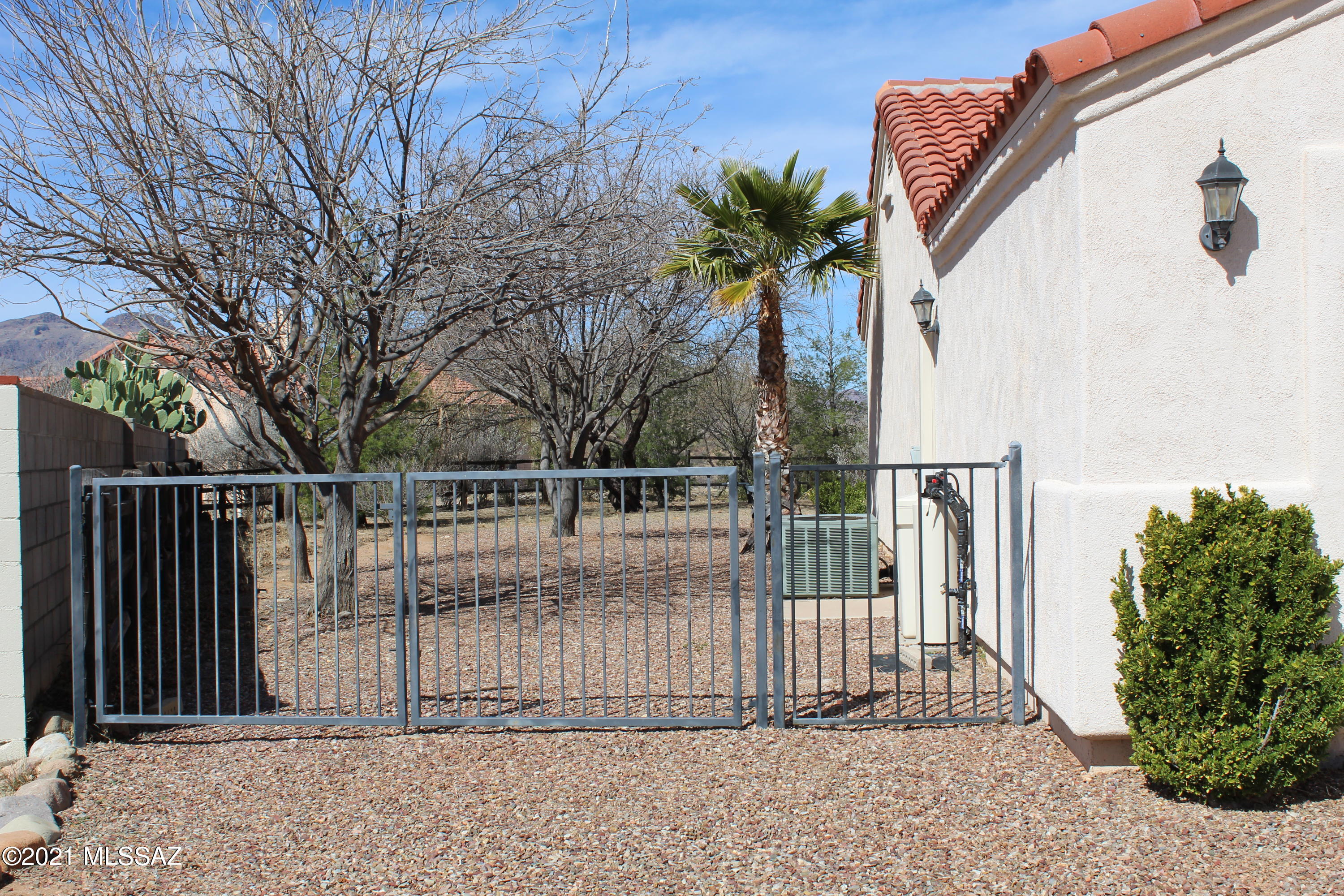 1704 Leary Court Rio Rico, AZ 85648 - Photo 3 of 37 a view of a entrance gate of a house