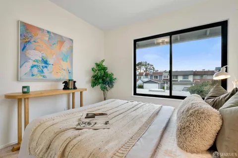 a bathroom with a toilet a sink and a mirror