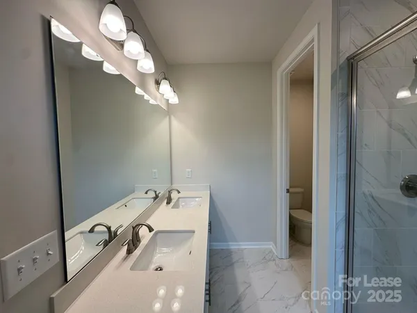 a bathroom with a sink and mirror