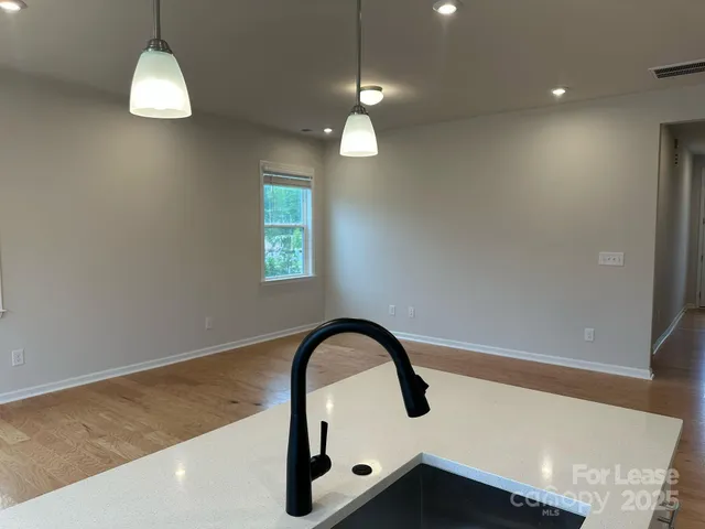 a close view of a sink and dishwasher in a bathroom