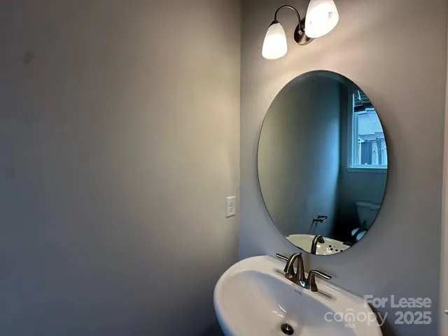 a bathroom with a sink and mirror