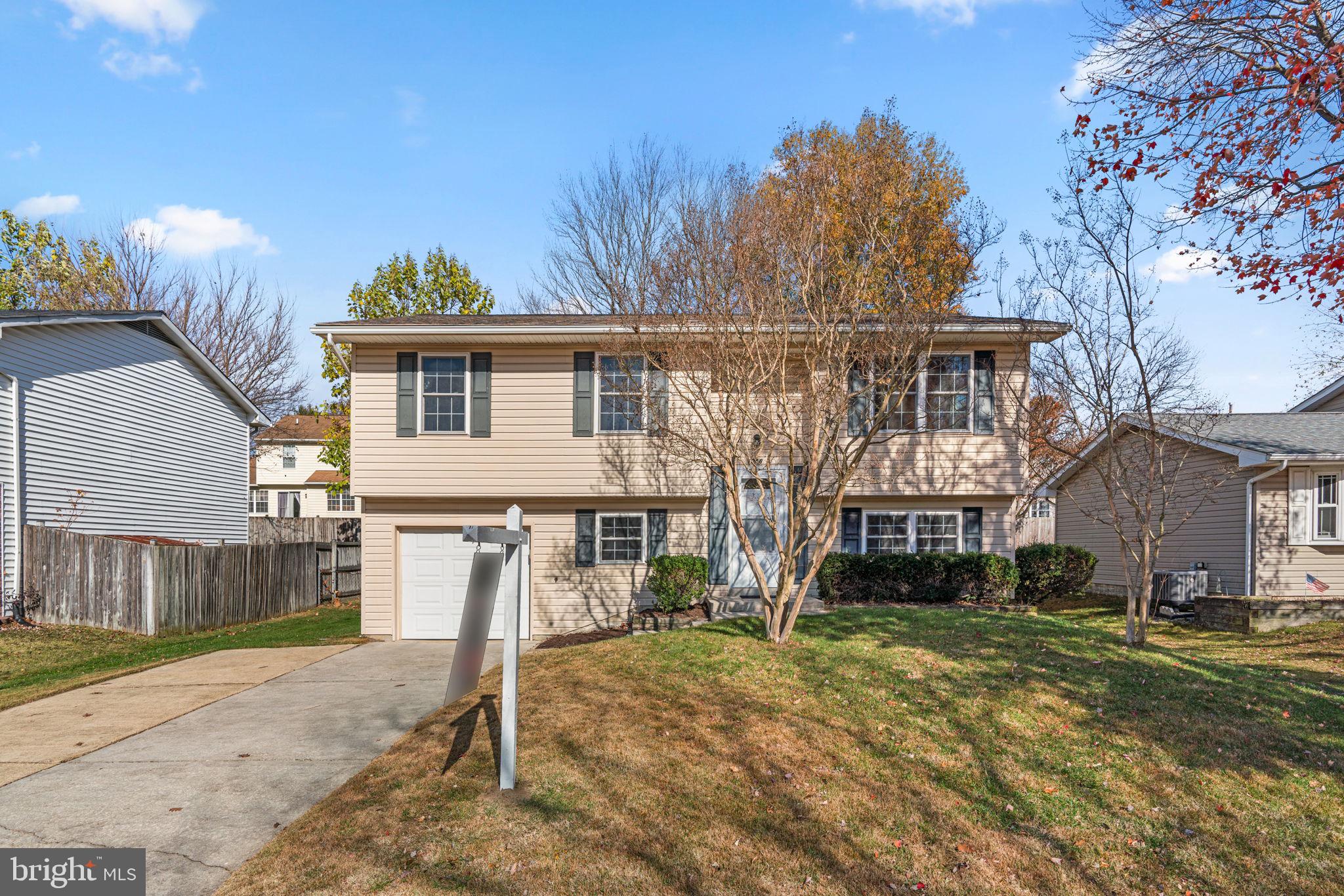 1818 Lasalle Place Severn, MD 21144 - Photo 1 of 30 a view of a house with a yard and large tree