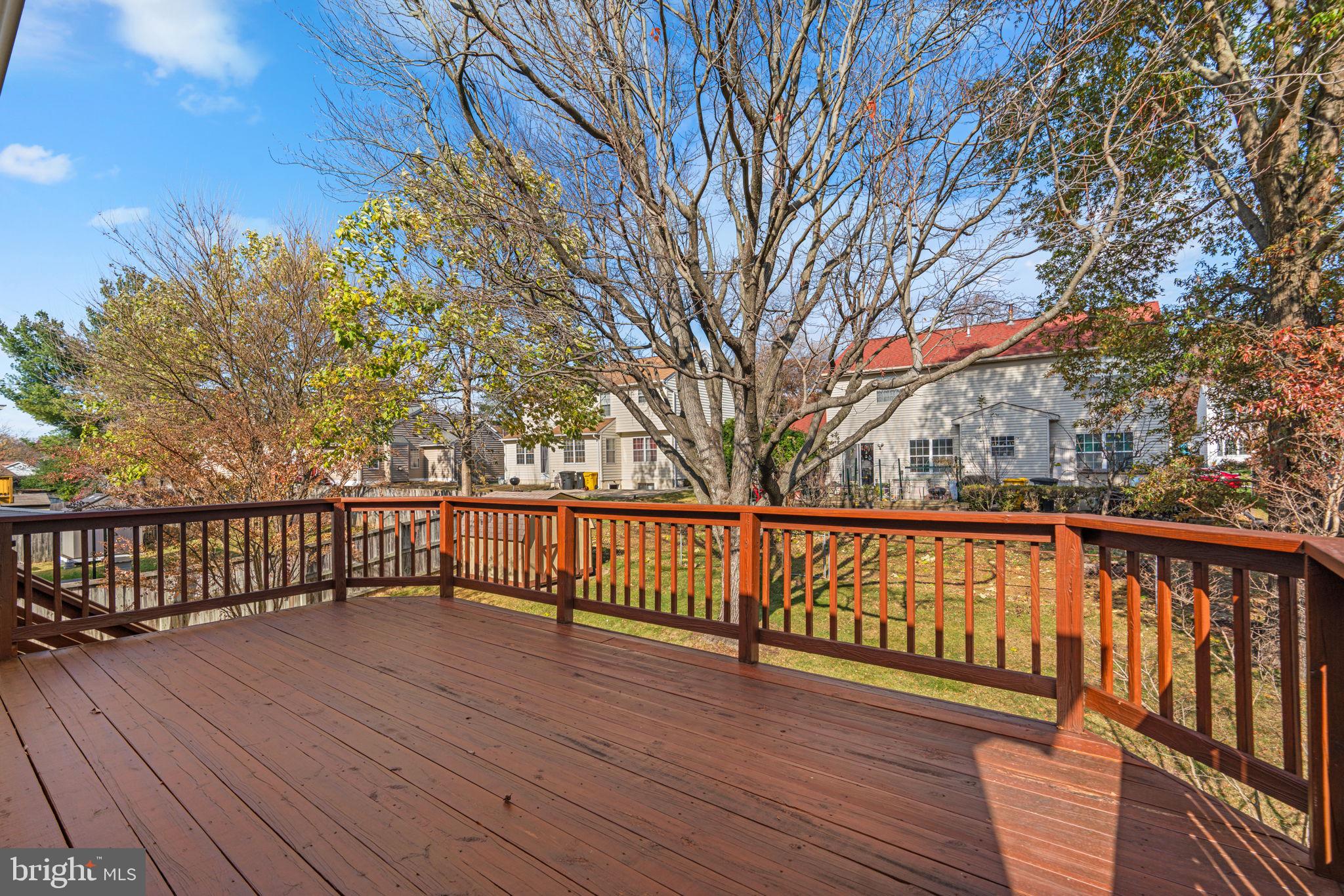 1818 Lasalle Place Severn, MD 21144 - Photo 27 of 30 a balcony with wooden floor and trees