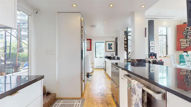 a kitchen with stainless steel appliances granite countertop a stove and a sink