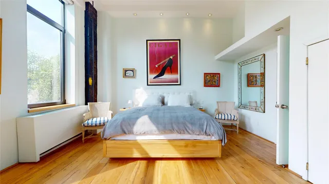 a bedroom with a bed and a couch