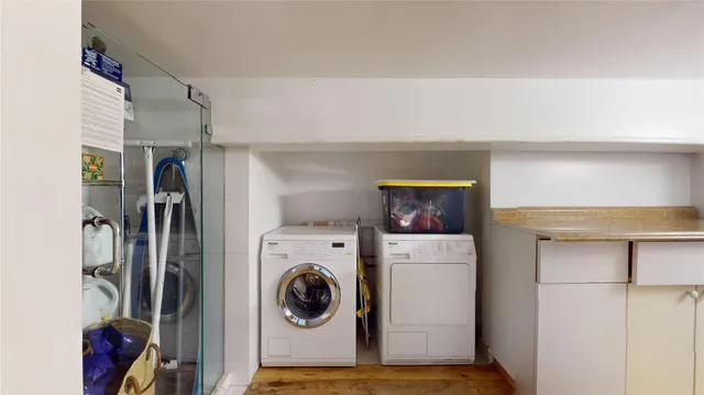 a view of a kitchen with refrigerator and stove