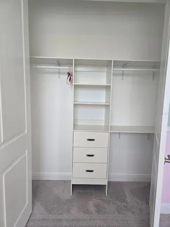 a view of an empty walk in closet