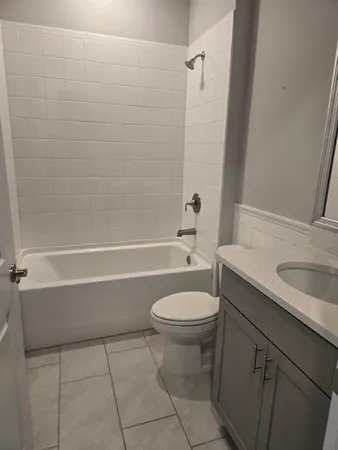 a bathroom with a sink a toilet and a bathtub