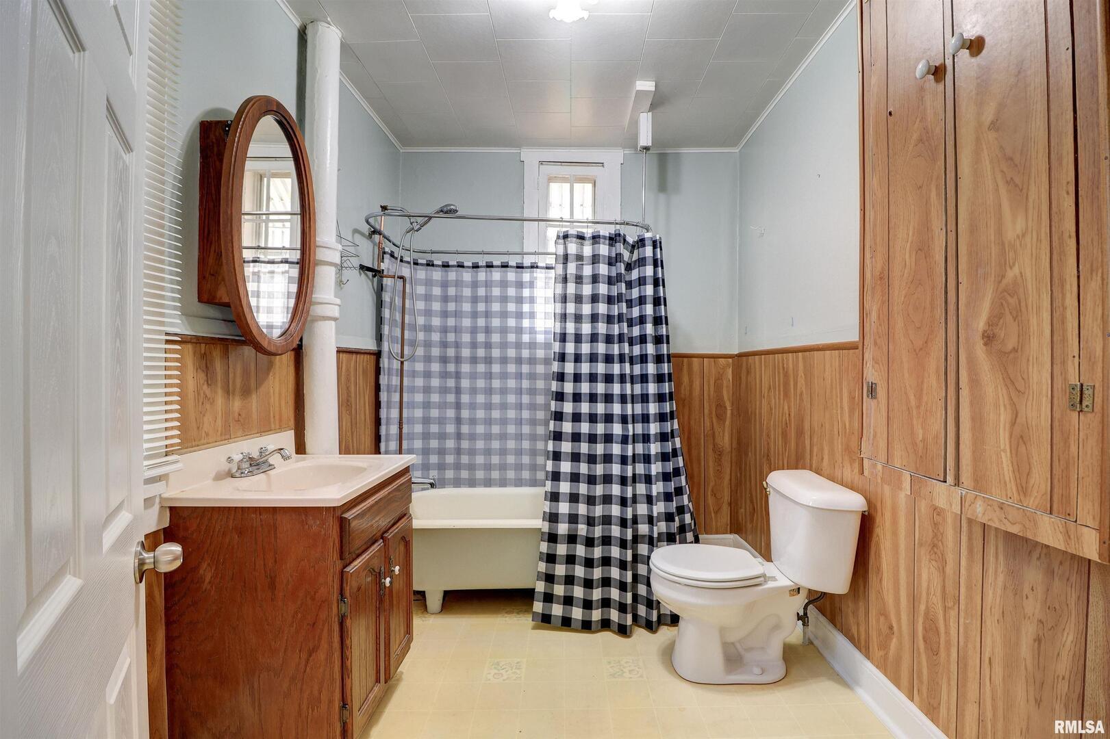 1913 Pershing Boulevard Clinton, IA 52732 - Photo 14 of 26 a bathroom with a sink toilet and shower