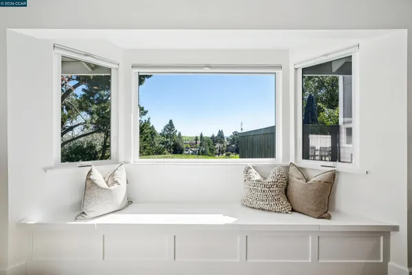 a bathroom with a bathtub and a window