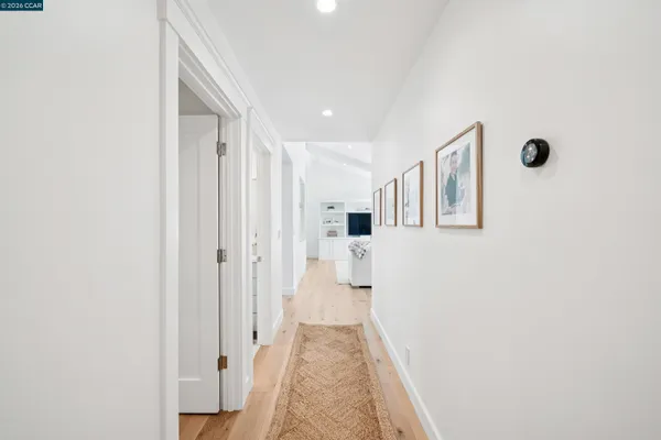 a view of a hallway with white walls