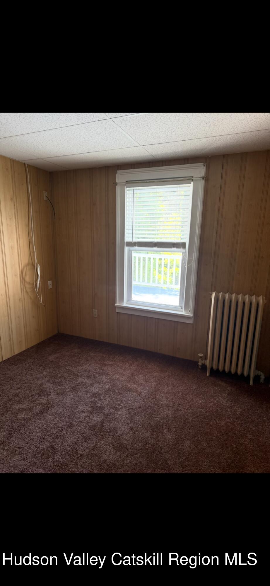 86 Ulster Avenue, Unit B Saugerties, NY 12477 - Photo 14 of 16 a view of an empty room with a window