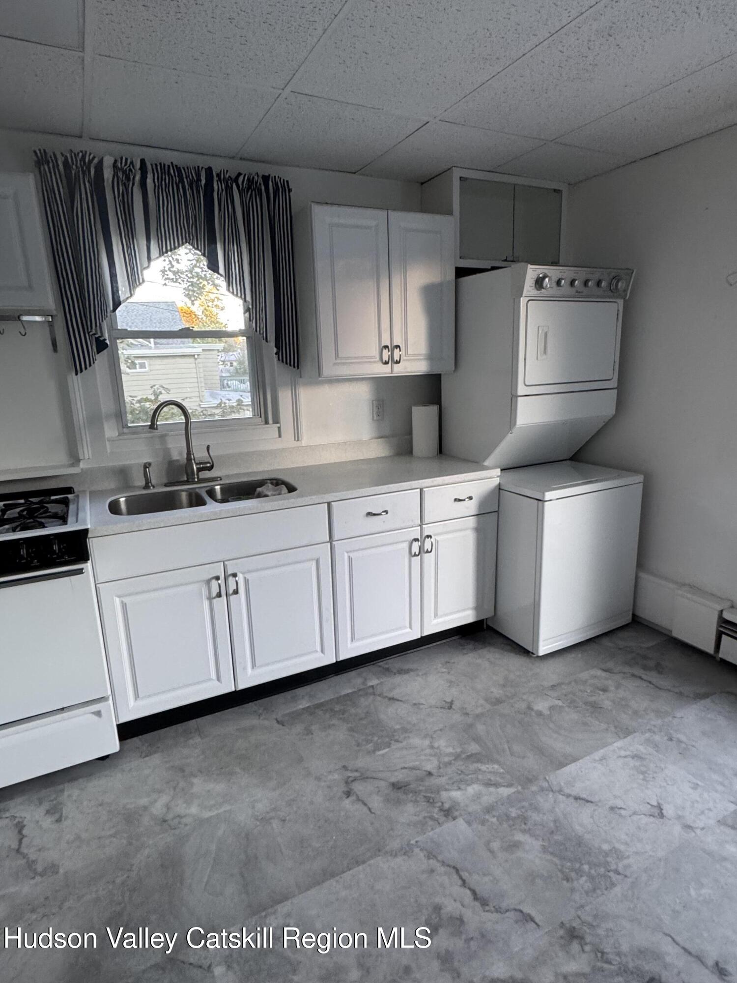 86 Ulster Avenue, Unit B Saugerties, NY 12477 - Photo 7 of 16 a bathroom with a sink and a mirror