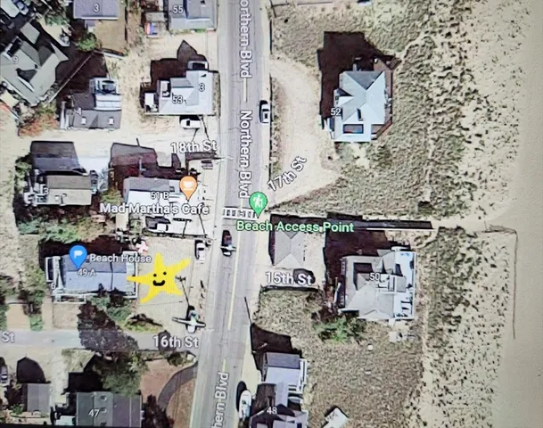 an aerial view of houses with outdoor space