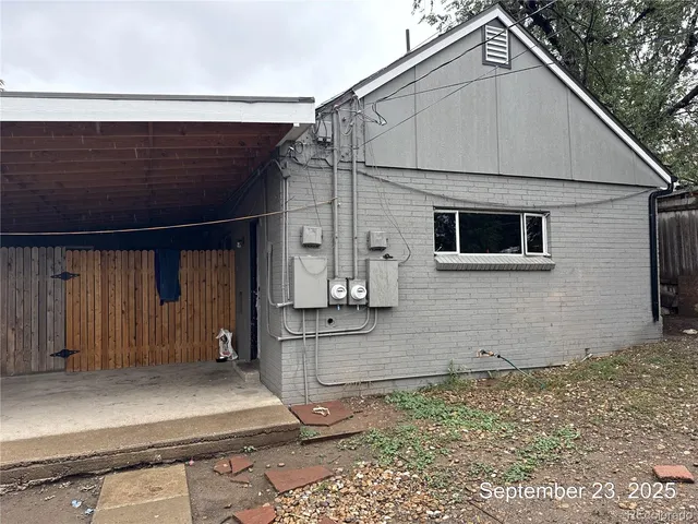 a view of a house with wooden fence