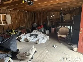 a room with gym equipment and a mirror