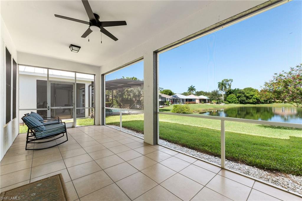 223 Stanhope Circle Naples, FL 34104 - Photo 26 of 41 Screened patio featuring tile flooring and a ceiling fan