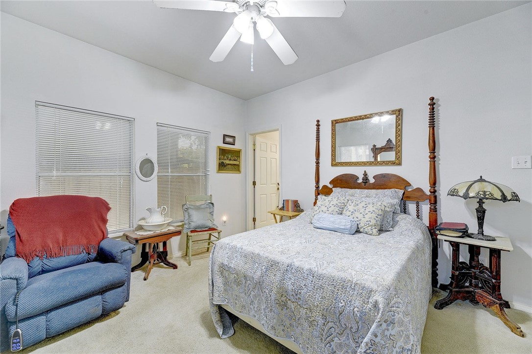 604 Fletcher Street Austin, TX 78704 - Photo 11 of 35 a bedroom with a bed couch and a window