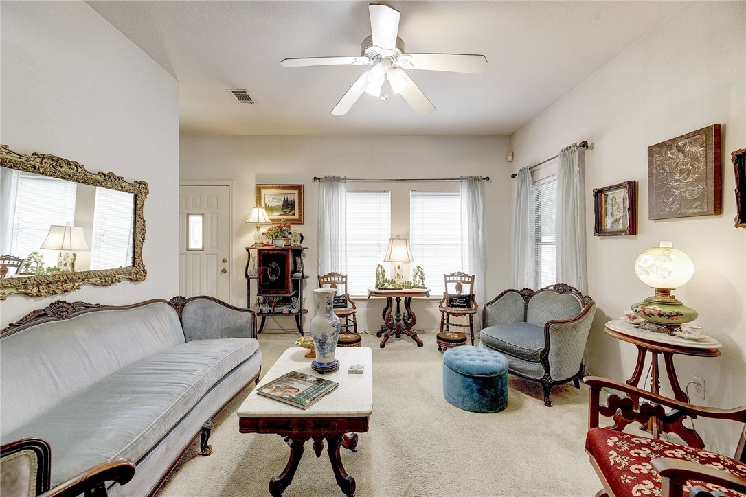 604 Fletcher Street Austin, TX 78704 - Photo 19 of 35 a living room with furniture and a flat screen tv with wooden floor
