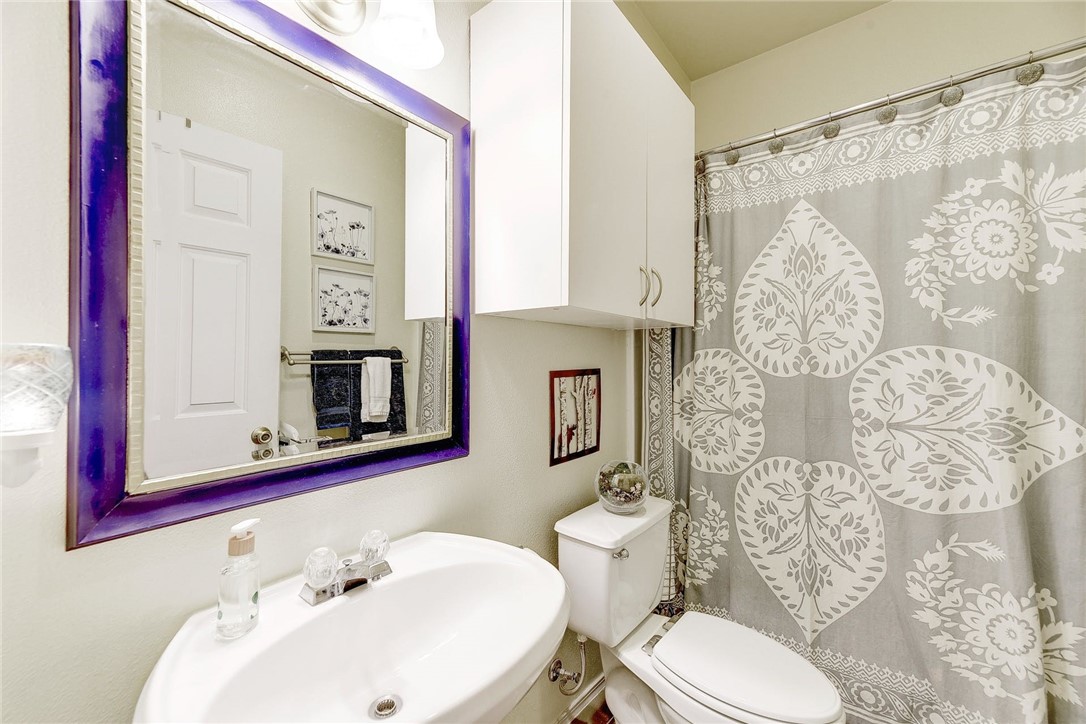 604 Fletcher Street Austin, TX 78704 - Photo 21 of 35 a bathroom with a sink toilet and shower