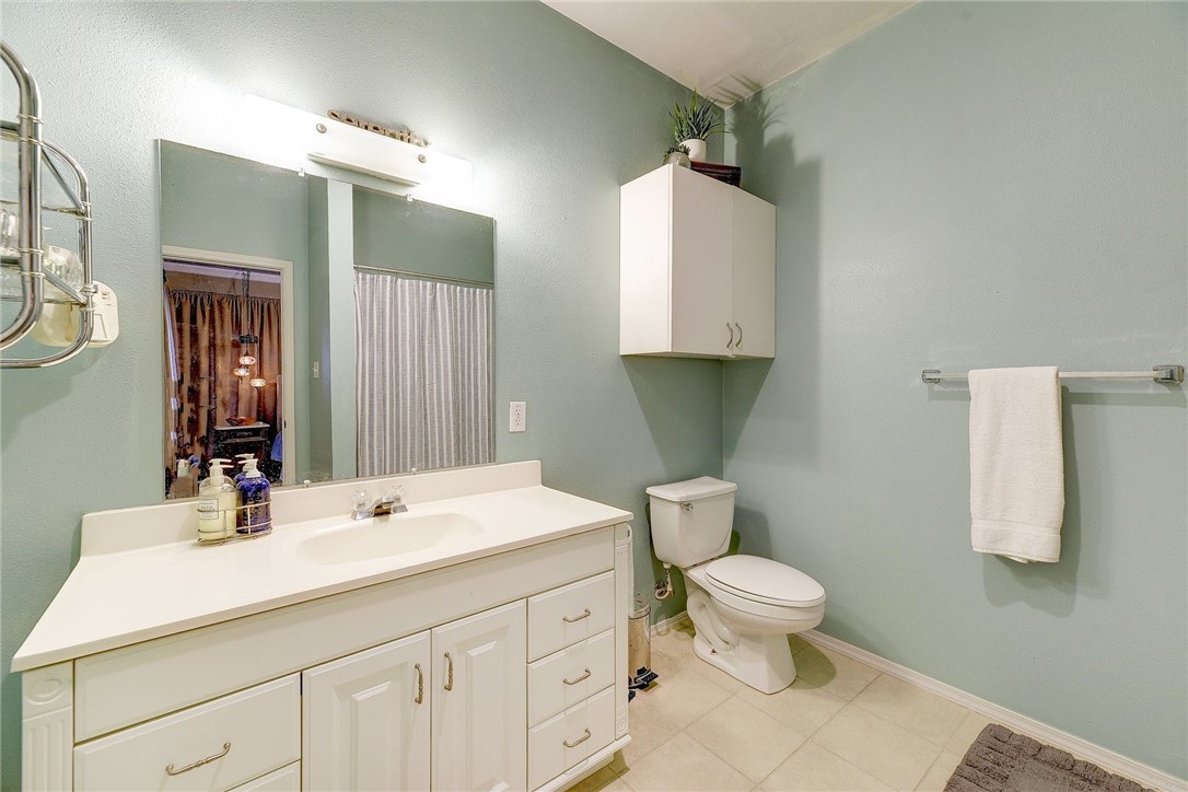 604 Fletcher Street Austin, TX 78704 - Photo 23 of 35 a bathroom with a sink toilet and mirror