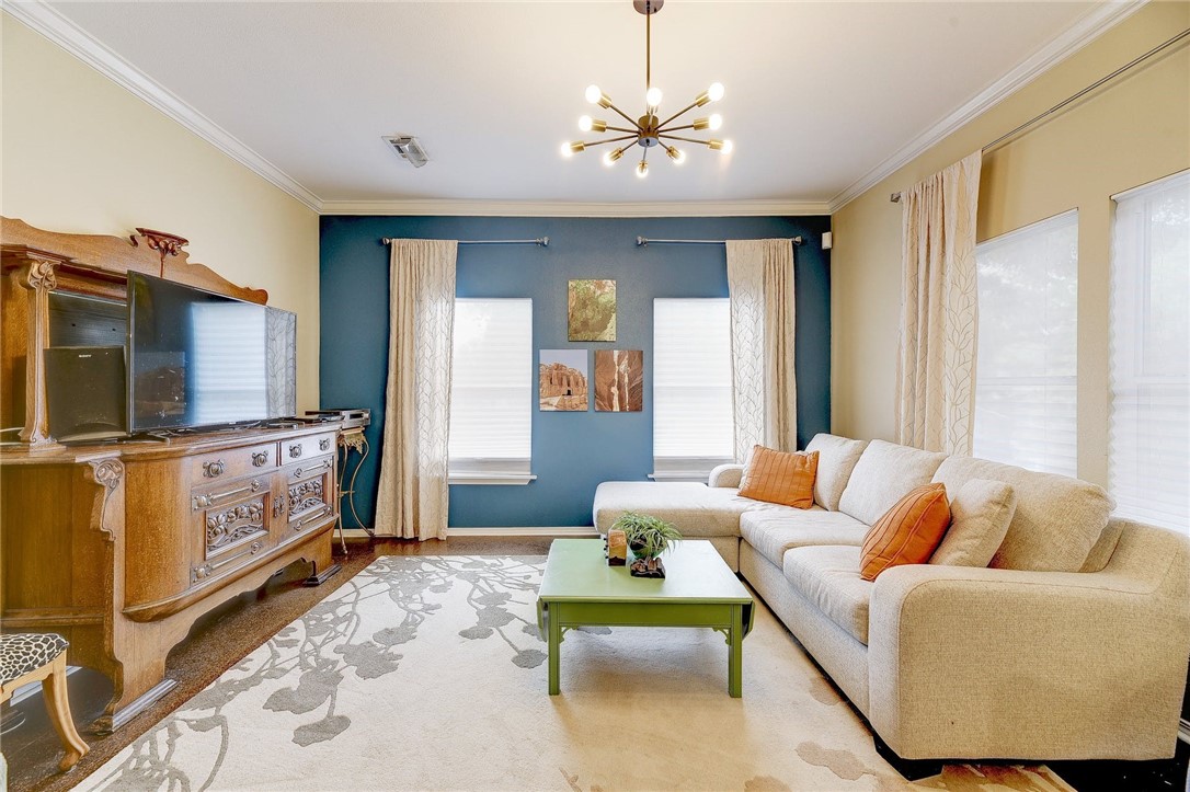 604 Fletcher Street Austin, TX 78704 - Photo 33 of 35 a living room with furniture and a flat screen tv