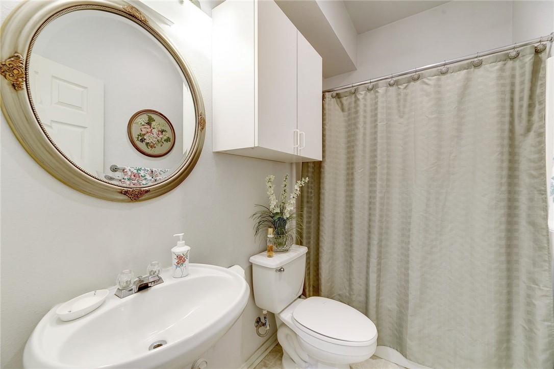 604 Fletcher Street Austin, TX 78704 - Photo 8 of 35 a bathroom with a toilet and a sink