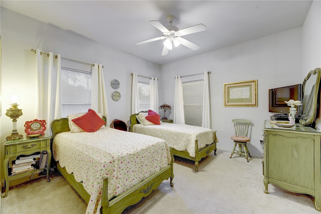 604 Fletcher Street Austin, TX 78704 - Photo 9 of 35 a bedroom with two beds and a flat screen tv