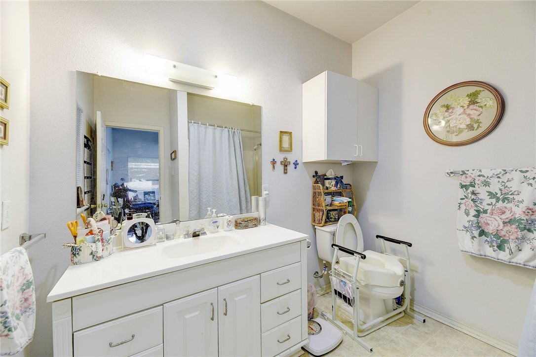 604 Fletcher Street Austin, TX 78704 - Photo 10 of 35 a bathroom with a sink and a mirror
