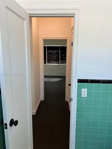 a view of hallway with washer and dryer