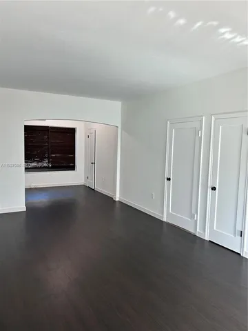 a view of a livingroom with an empty space and a fireplace