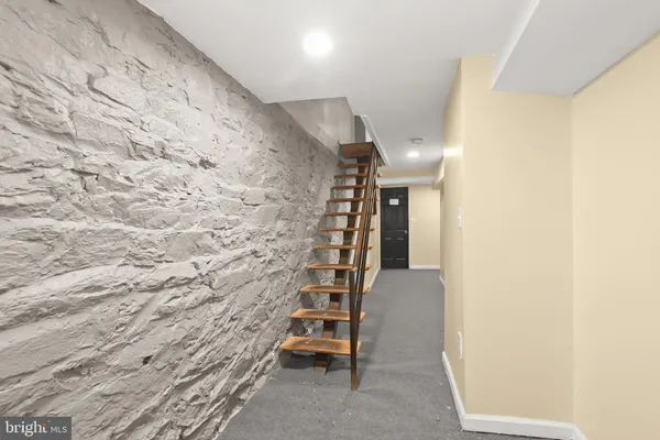 a bedroom with bed and a potted plant