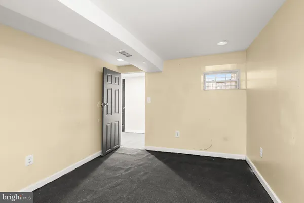 a kitchen with a refrigerator and a stove