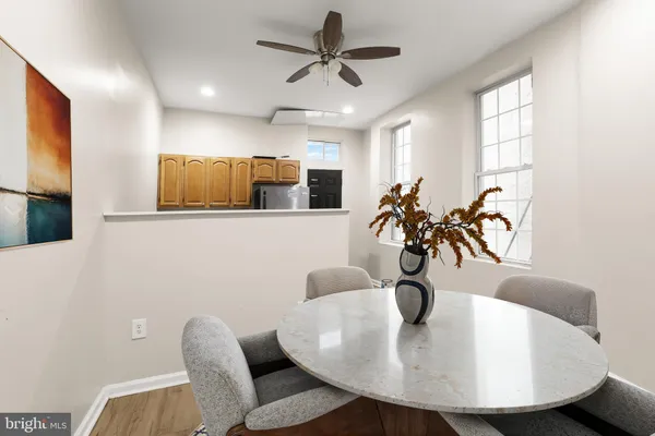 a view of a kitchen with a refrigerator a microwave and a sink