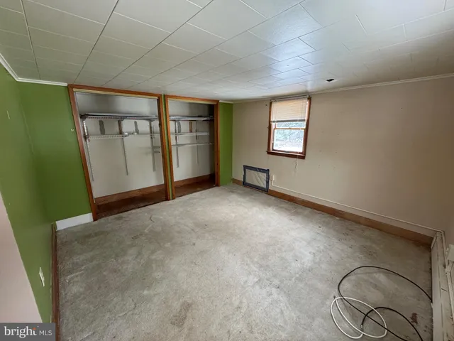 a view of a house with a snow in the yard