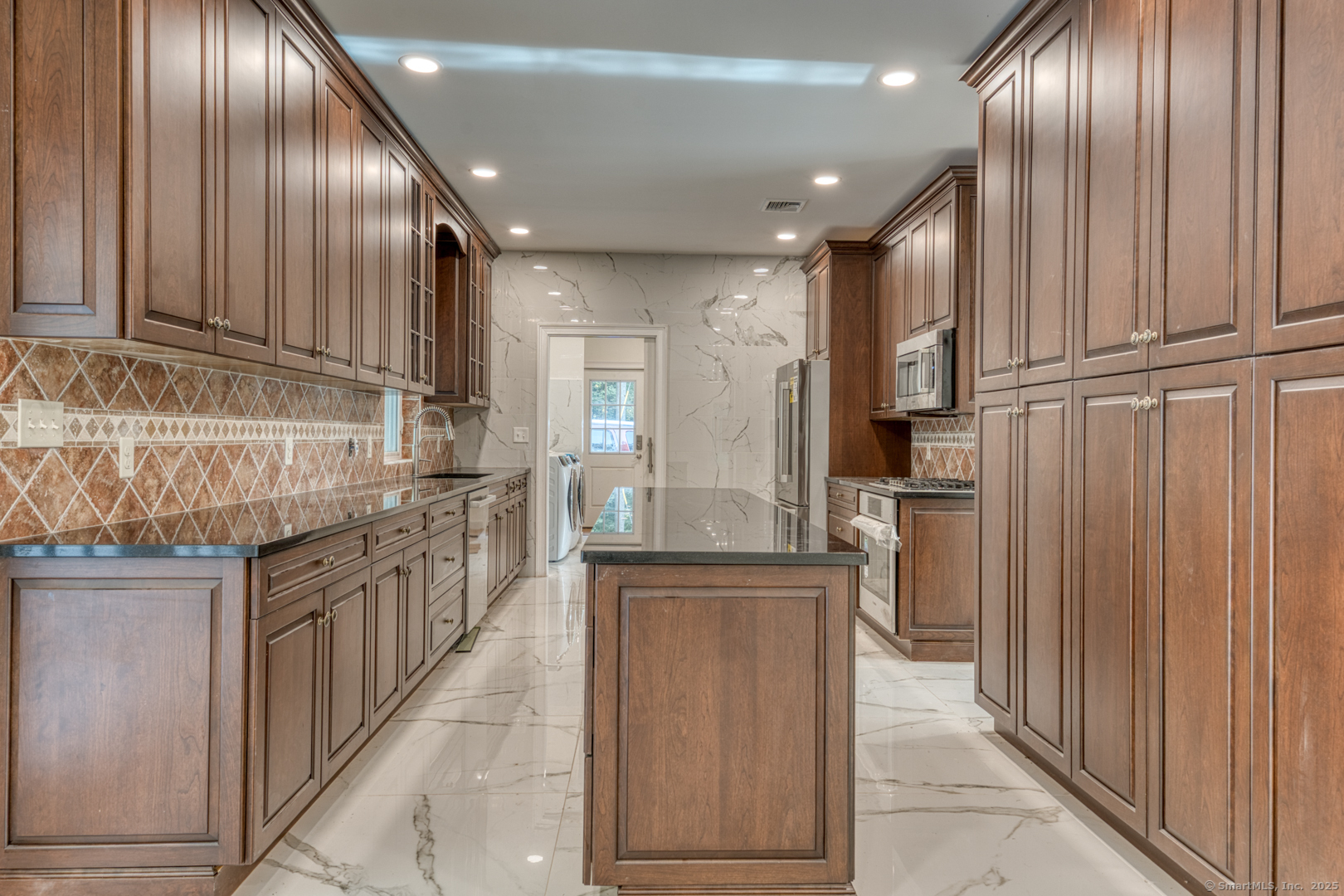 171 Oregon Road Meriden, CT 06451 - Photo 12 of 38 a kitchen with stainless steel appliances granite countertop a refrigerator and a sink