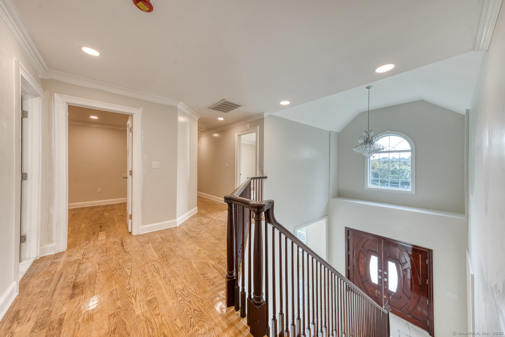 171 Oregon Road Meriden, CT 06451 - Photo 20 of 38 a view of a hallway with wooden floor and staircase