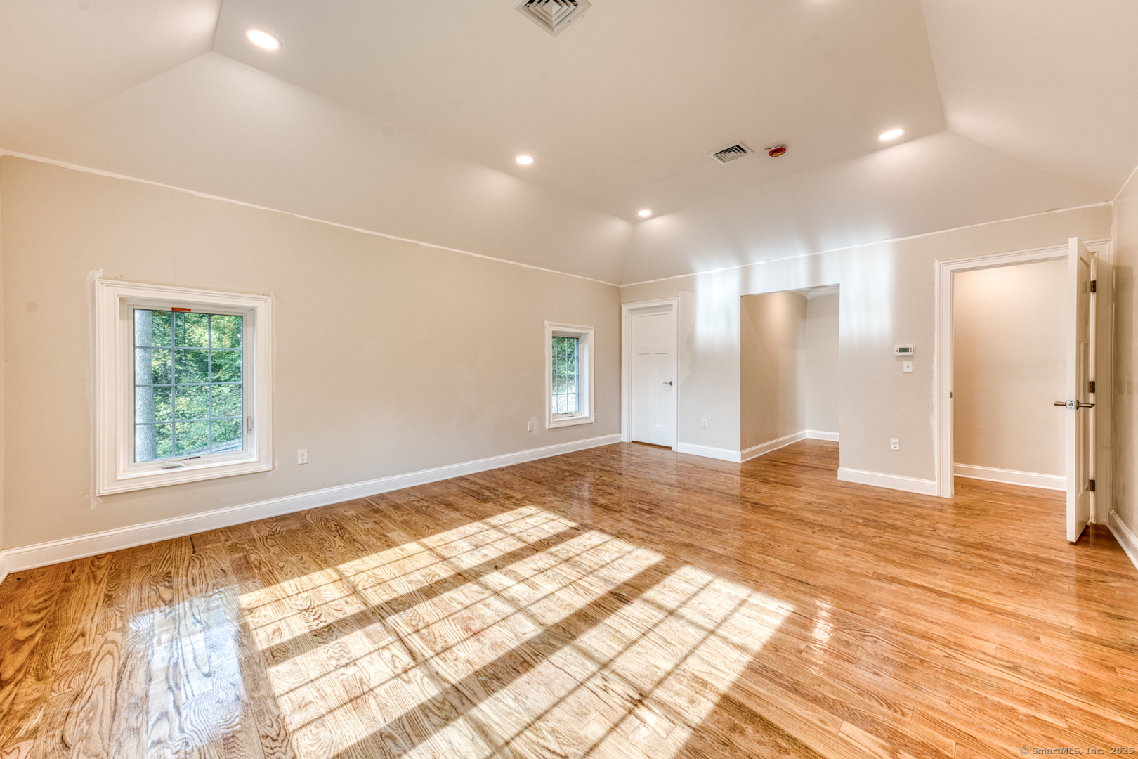 171 Oregon Road Meriden, CT 06451 - Photo 23 of 38 a view of empty room with wooden floor and fan