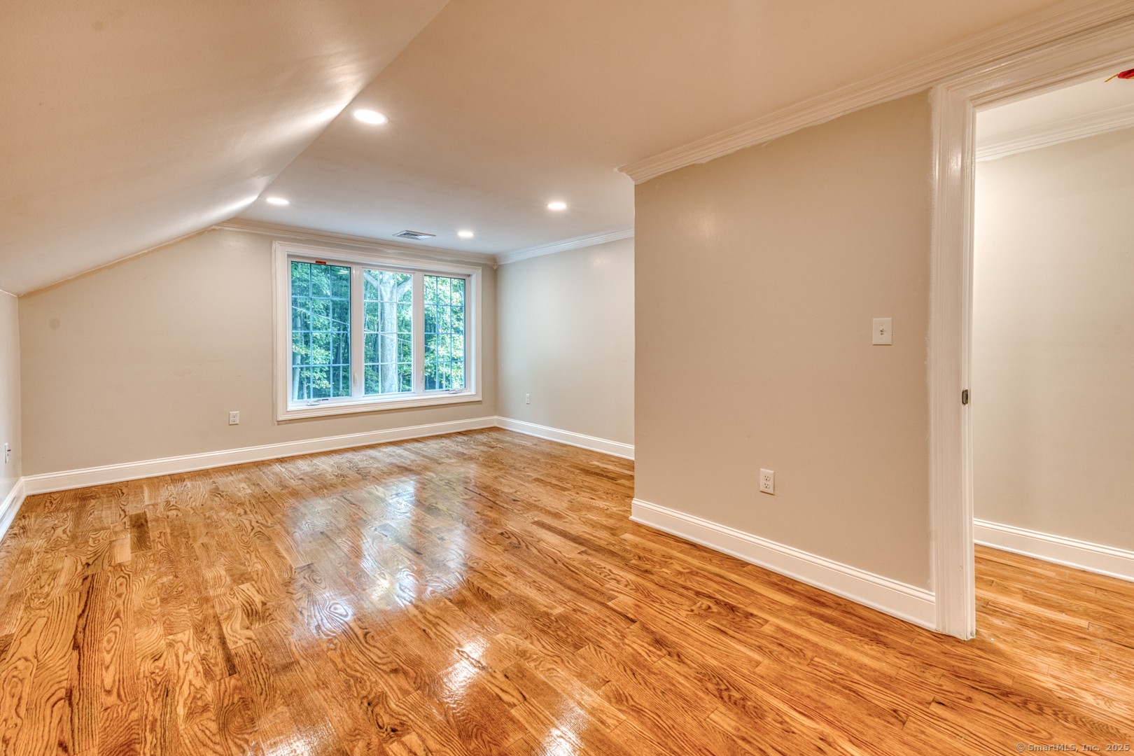 171 Oregon Road Meriden, CT 06451 - Photo 26 of 38 an empty room with wooden floor and windows