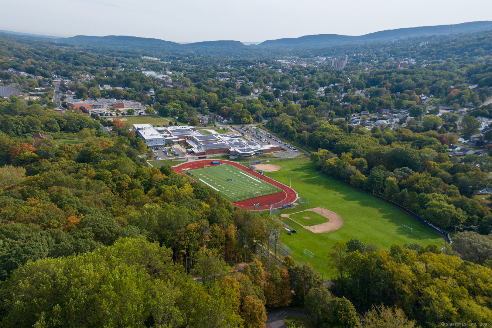 171 Oregon Road Meriden, CT 06451 - Photo 5 of 38 an aerial view of residential houses with outdoor space and trees