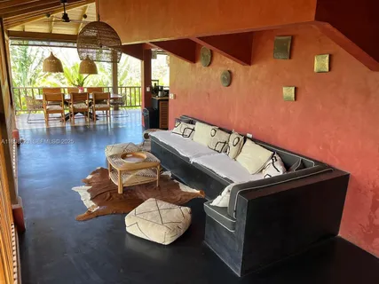 an aerial view of a house with a garden and trees