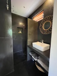 a bedroom with a bed and a desk