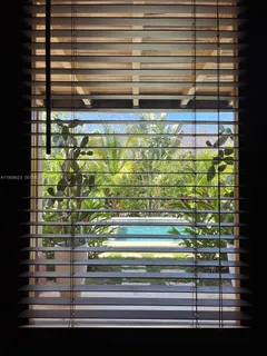 a bedroom with a bed and dresser with mirror